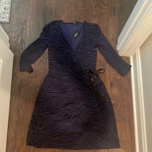 Express long sleeve purple and black zebra print cross cross tie dress. $25 NWT